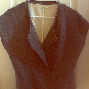 Asymmetrical shirt sleeve top.